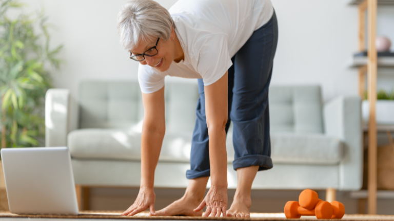 Woman stretching using online stroke recovery guide