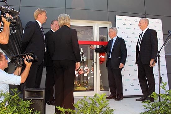 Professor Warwick Anderson AM, head of the NHMRC, cutting the ribbon.