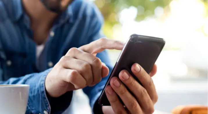 Man holding mobile phone