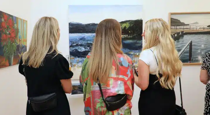 Women looking at art in an exhibition