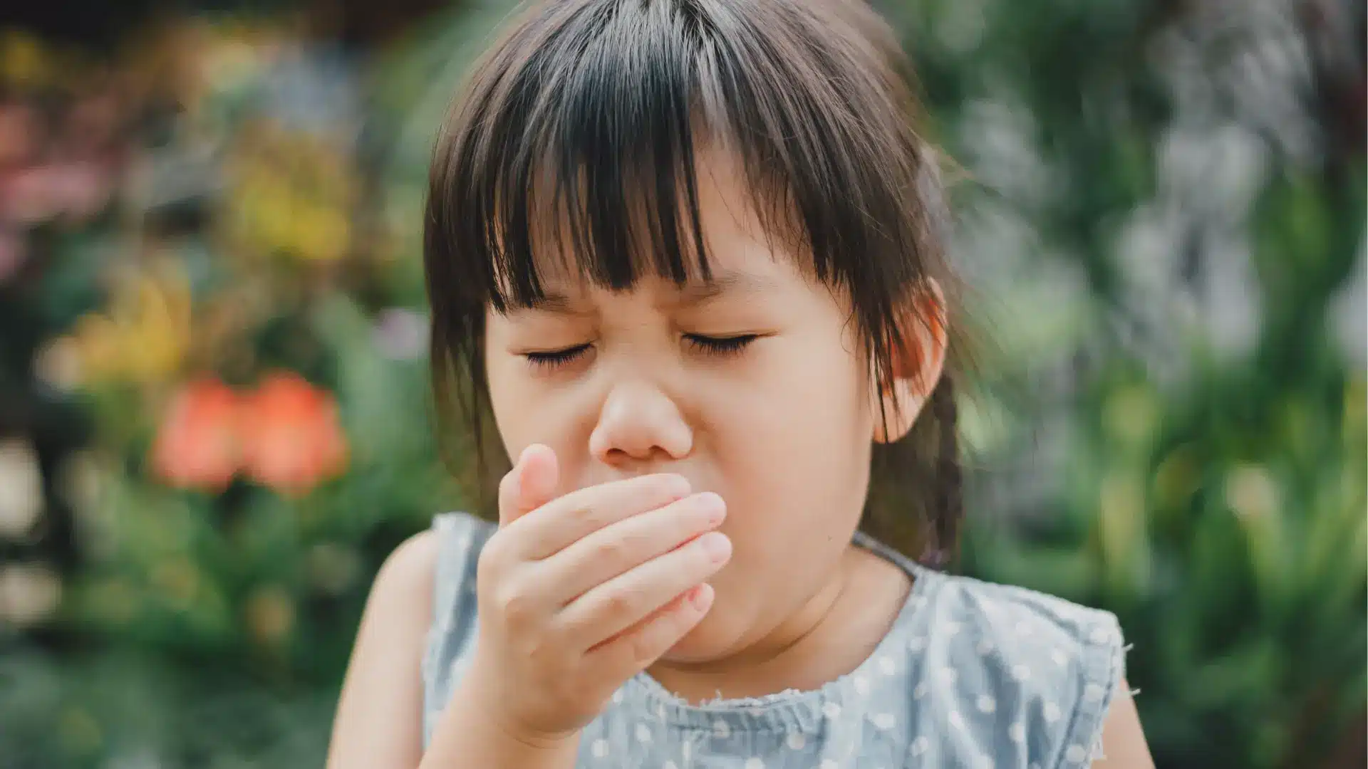 Young girl coughing