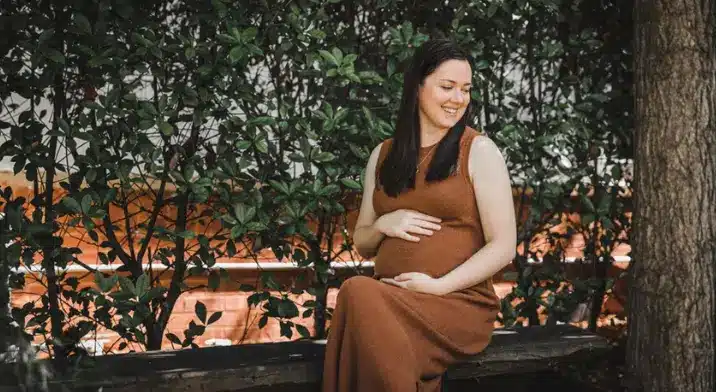 Pregnant lady sitting on bench