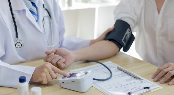 Person having a health check up by a doctor